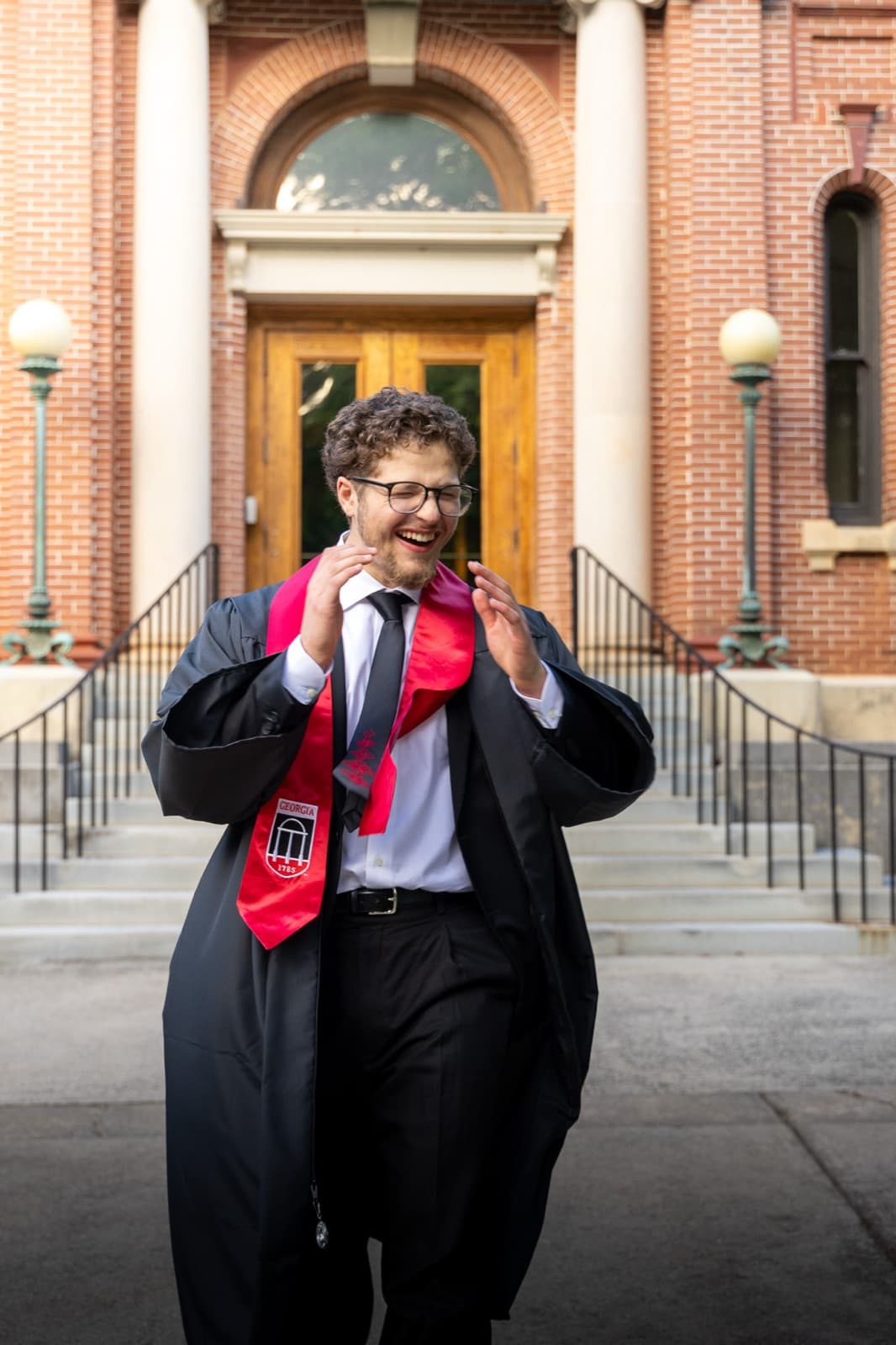 Closing frame: cracking up on the brick steps of Old College